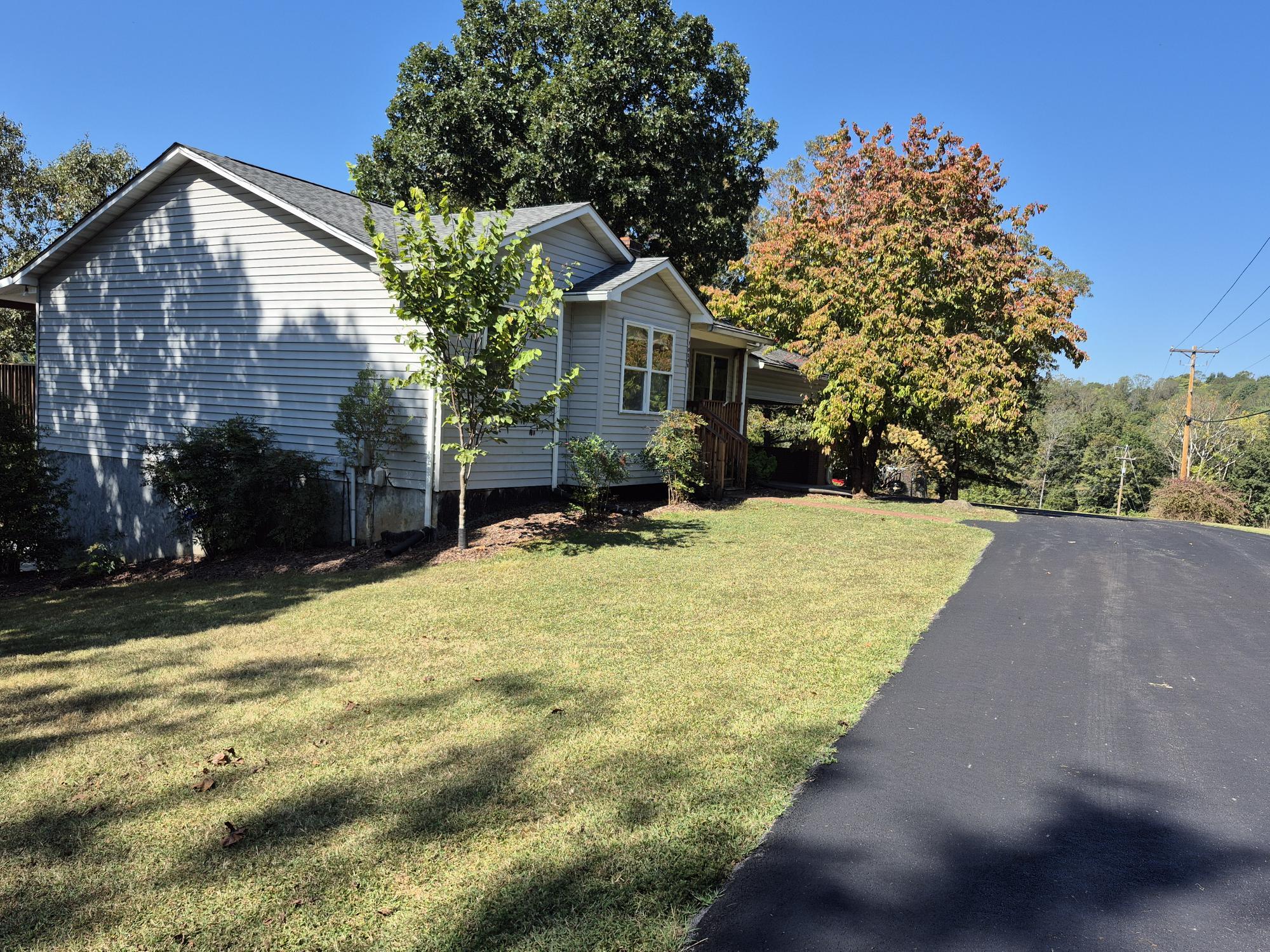 10048 Moneta Road Bedford, VA 24523 - Photo 49 of 51 a view of a house with a yard