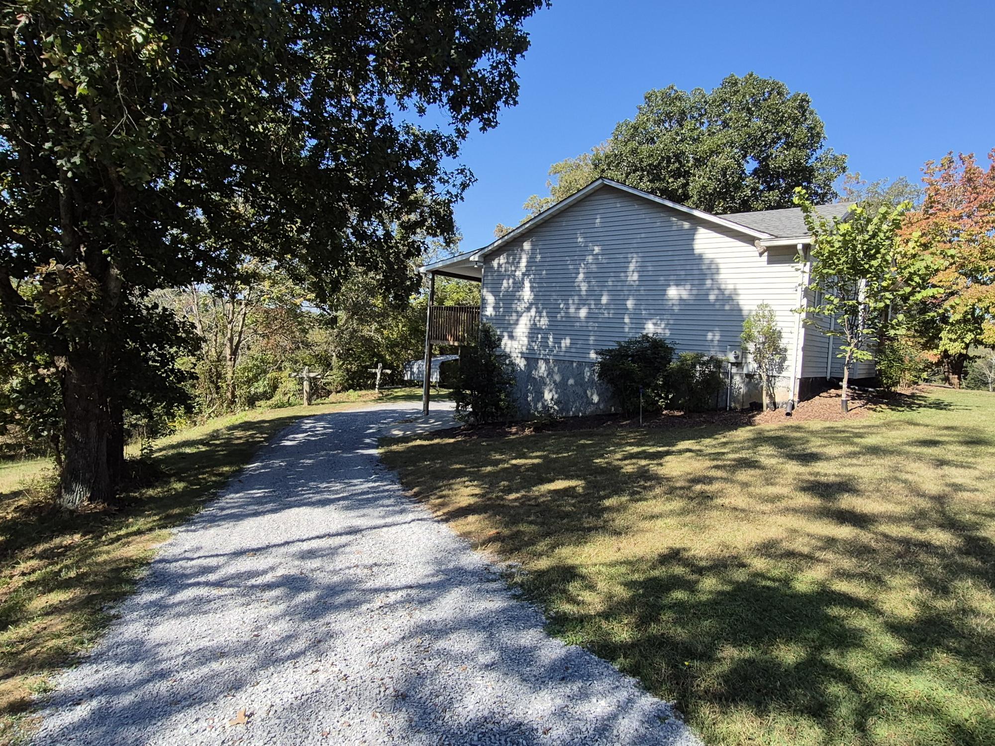 10048 Moneta Road Bedford, VA 24523 - Photo 7 of 51 a view of a house with a yard