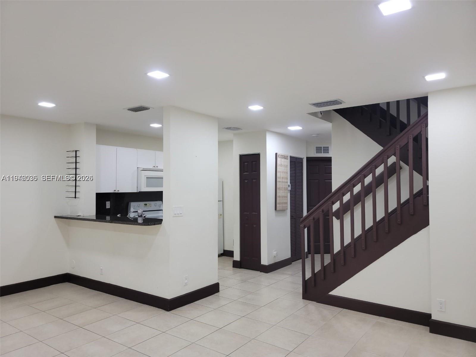 17401 Southwest 140th Court Miami, FL 33177 - Photo 13 of 42 a kitchen with furniture and a fireplace
