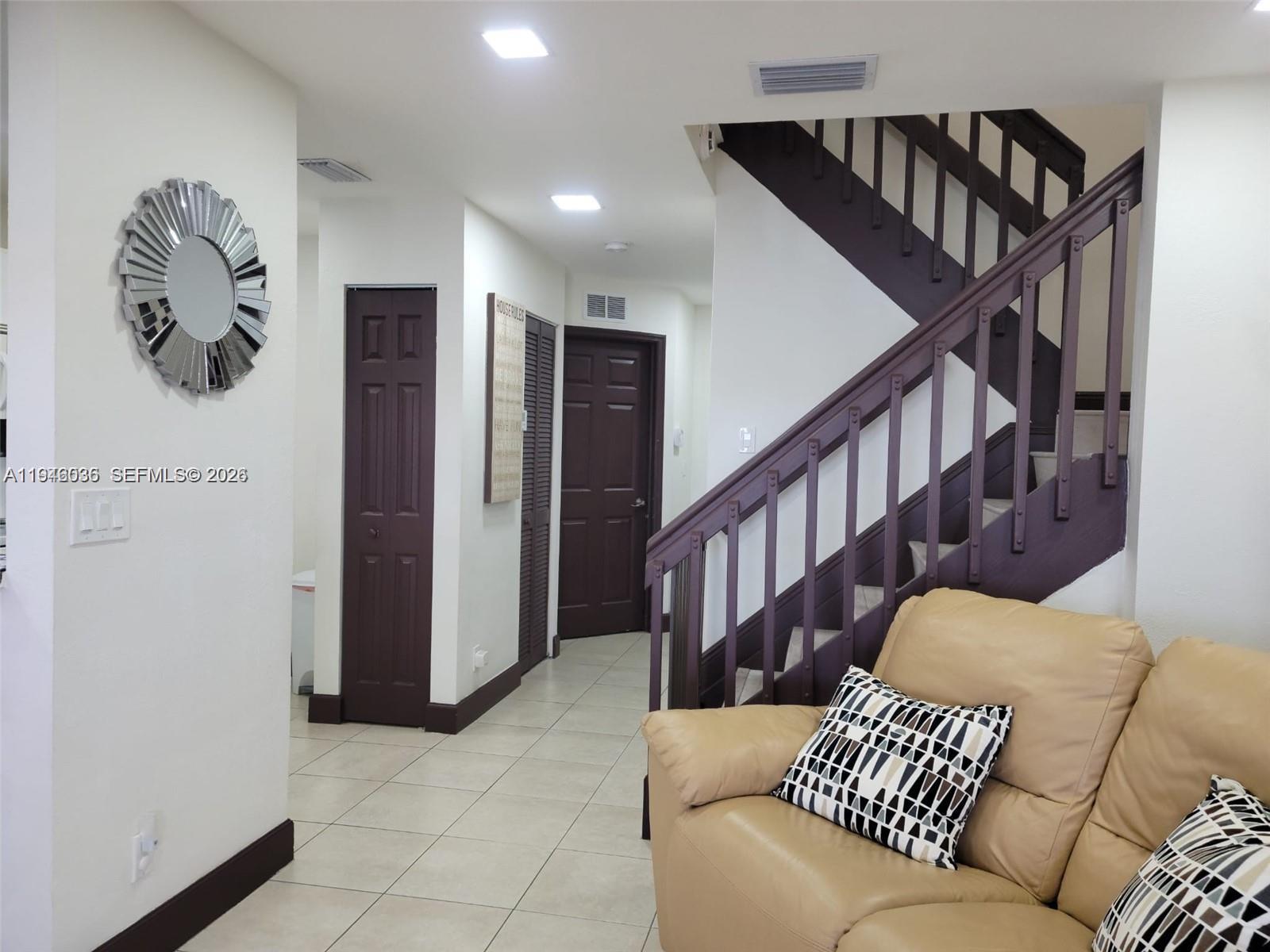 17401 Southwest 140th Court Miami, FL 33177 - Photo 16 of 42 a balcony with furniture and stairs