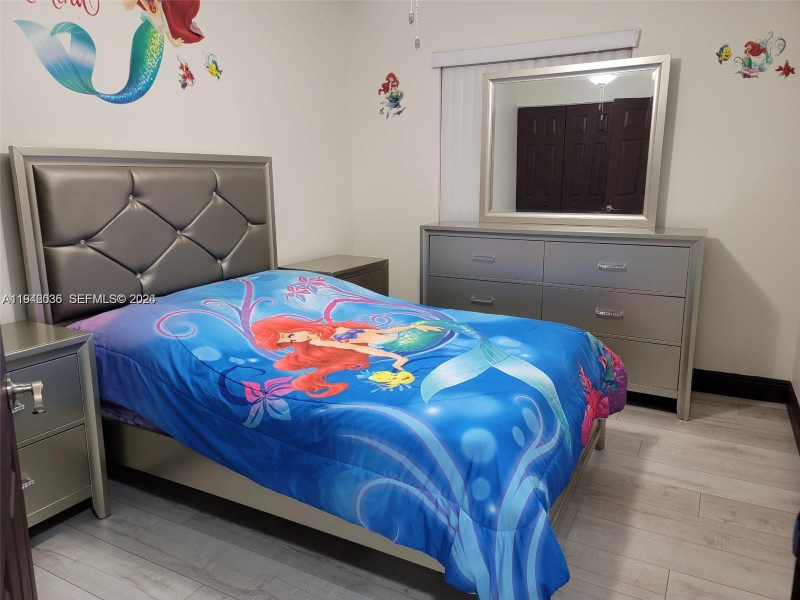 17401 Southwest 140th Court Miami, FL 33177 - Photo 25 of 42 a bedroom with a bed and a window