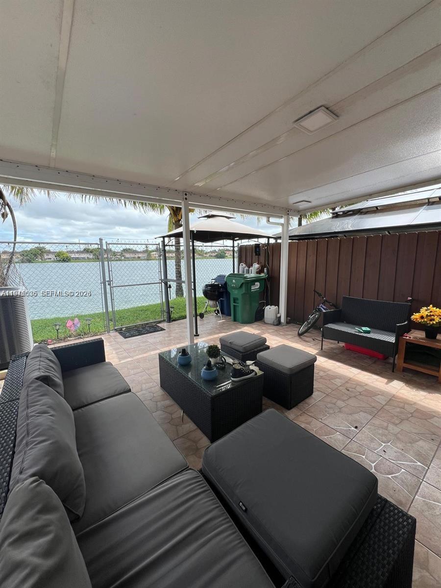 17401 Southwest 140th Court Miami, FL 33177 - Photo 37 of 42 a living room with furniture and a large window