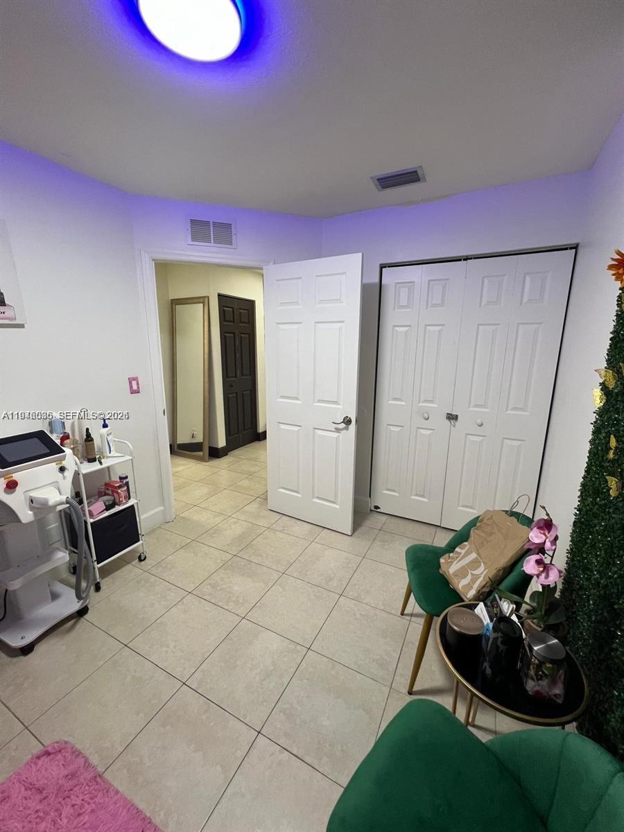 17401 Southwest 140th Court Miami, FL 33177 - Photo 9 of 42 a bedroom with furniture and a window