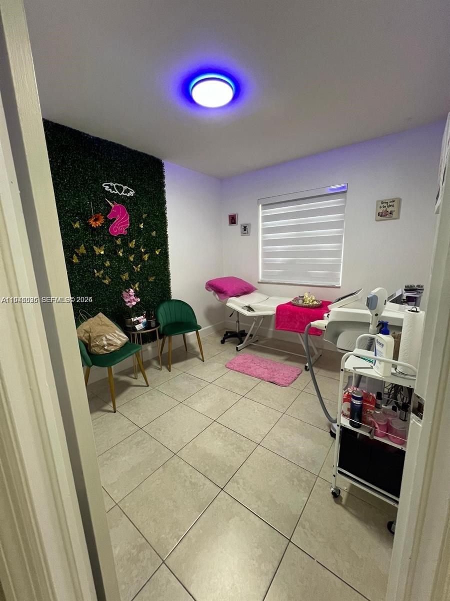 17401 Southwest 140th Court Miami, FL 33177 - Photo 10 of 42 a living room with furniture and flowers