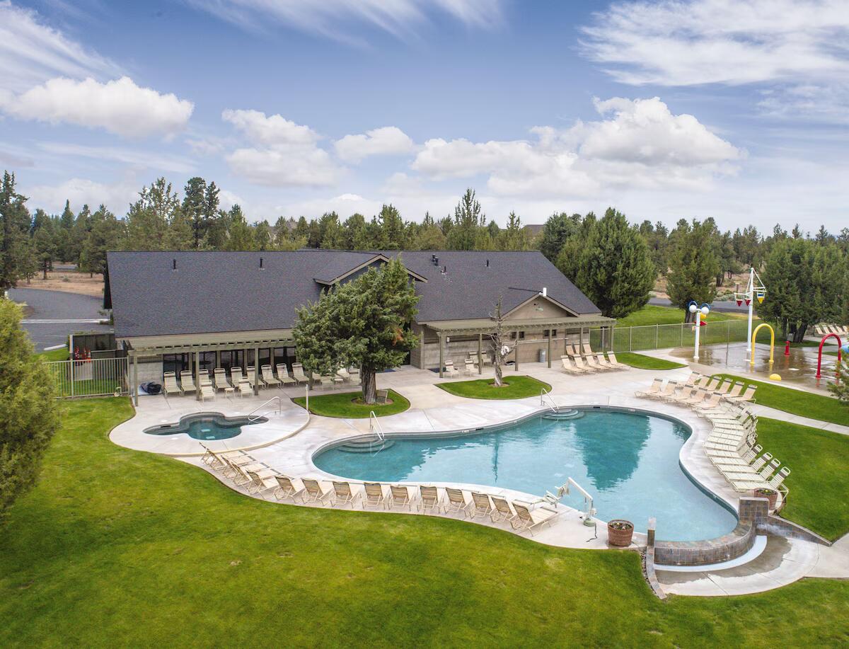10870 Village Loop Redmond, OR 97756 - Photo 34 of 35 a view of a swimming pool with a garden