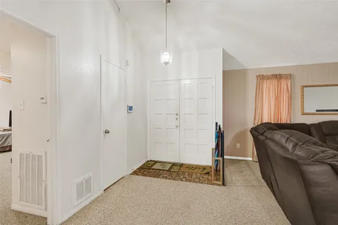a walk in closet with a couch