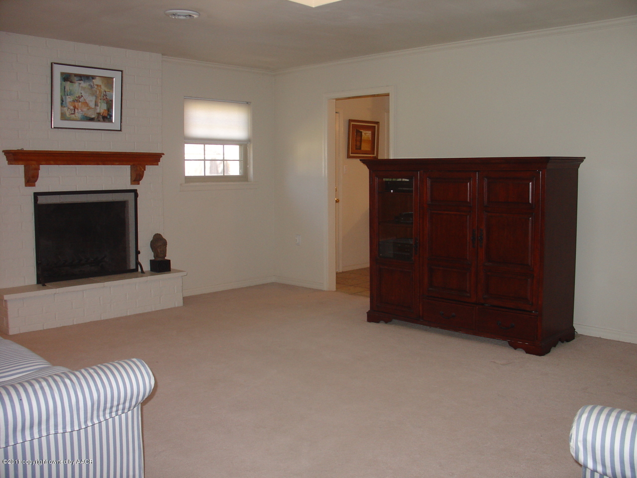 3306 Bedford Road Amarillo, TX 79106 - Photo 4 of 19 a living room with furniture and a fireplace