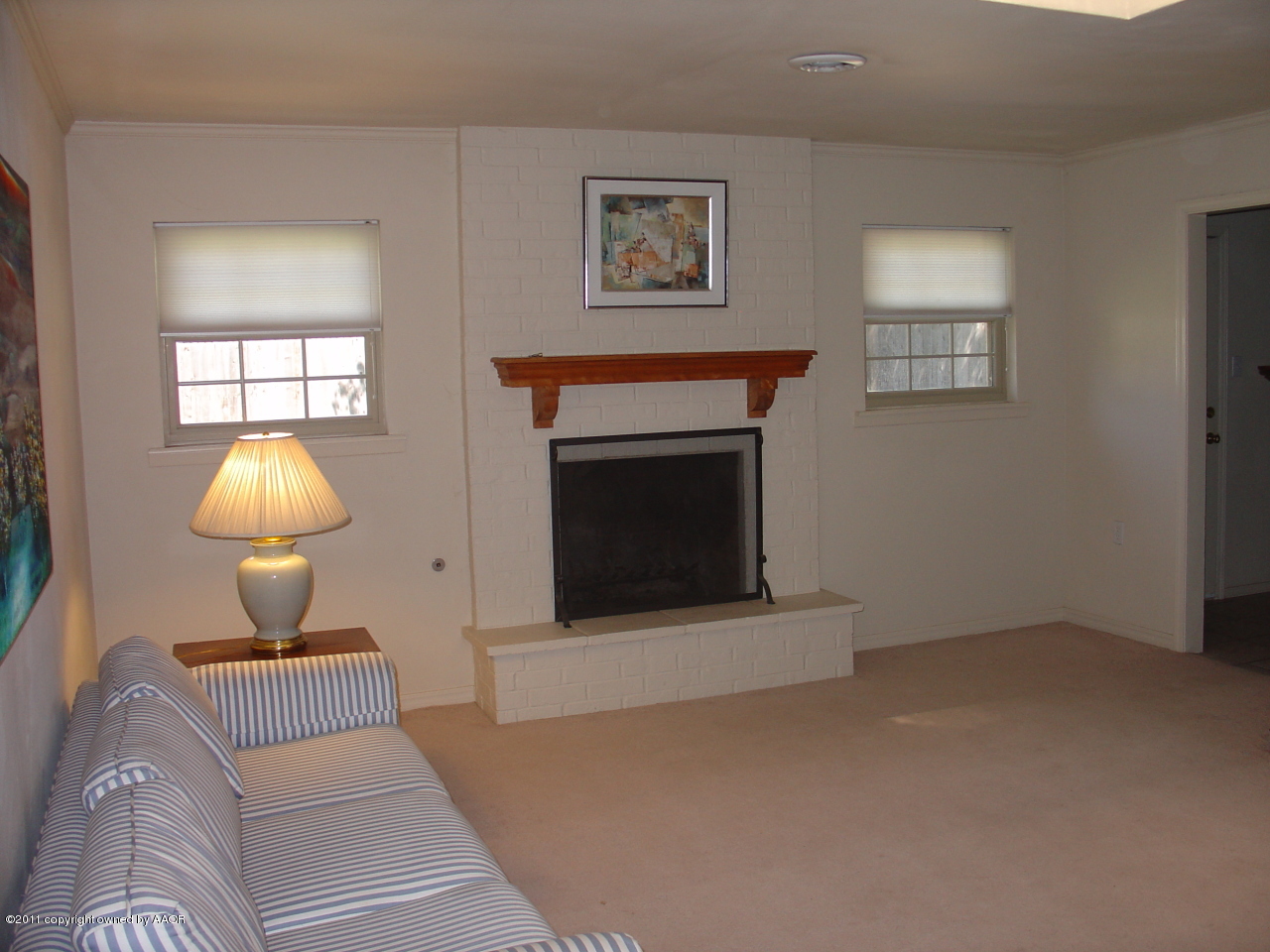 3306 Bedford Road Amarillo, TX 79106 - Photo 5 of 19 a living room with furniture and a fireplace