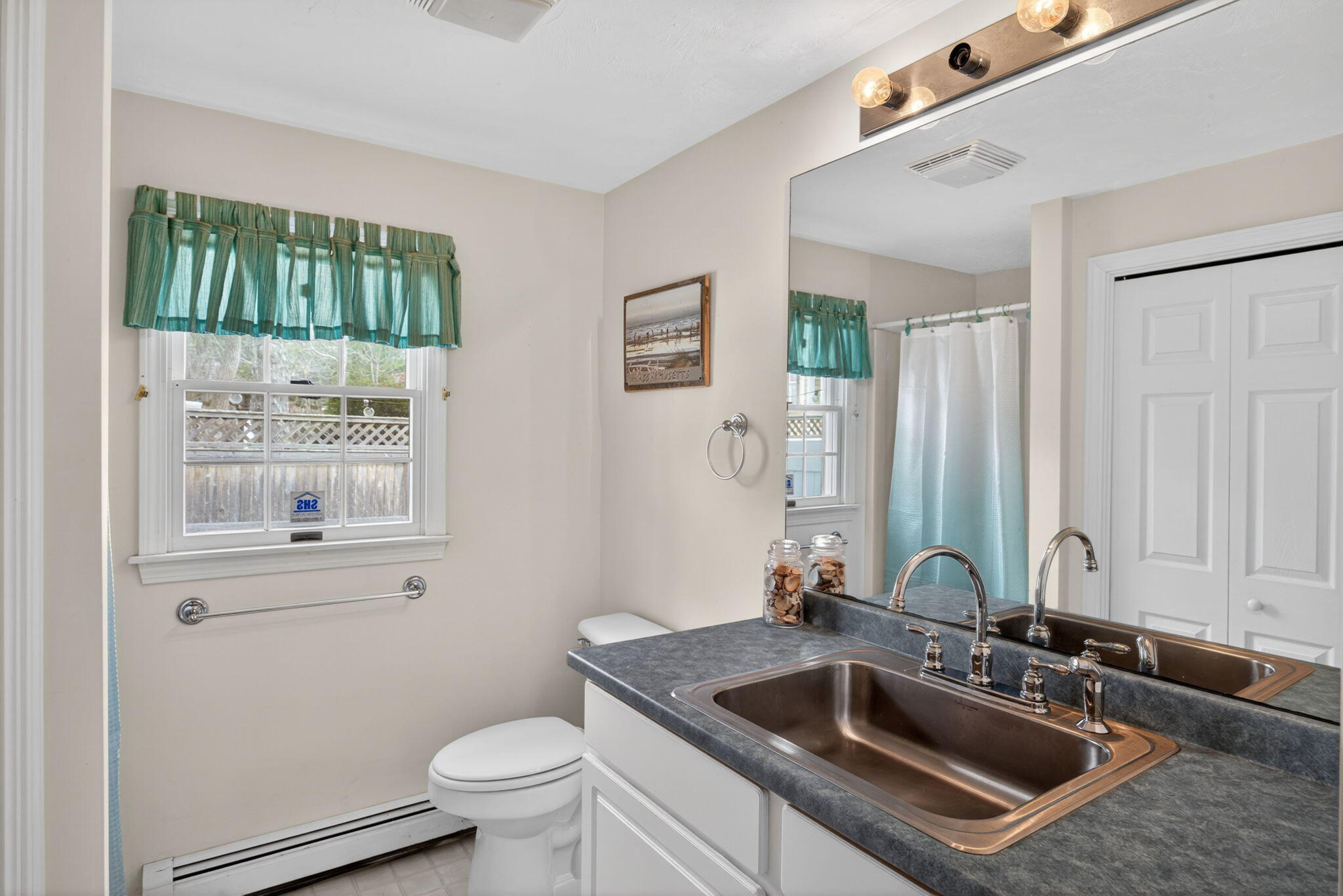 35 Pine Tree Road South Chatham, MA 02659 - Photo 15 of 39 a bathroom with a granite countertop sink a mirror and a toilet