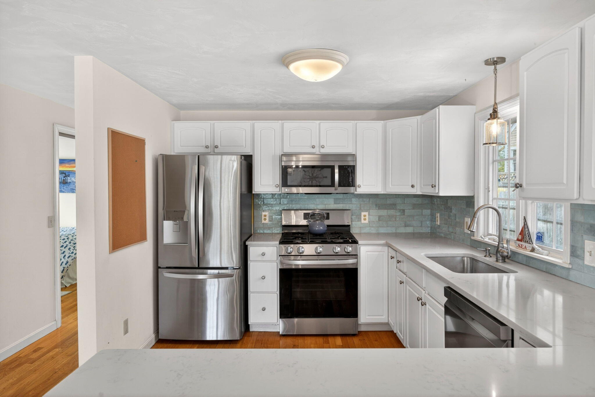 35 Pine Tree Road South Chatham, MA 02659 - Photo 9 of 39 a kitchen with stainless steel appliances granite countertop a refrigerator stove and sink