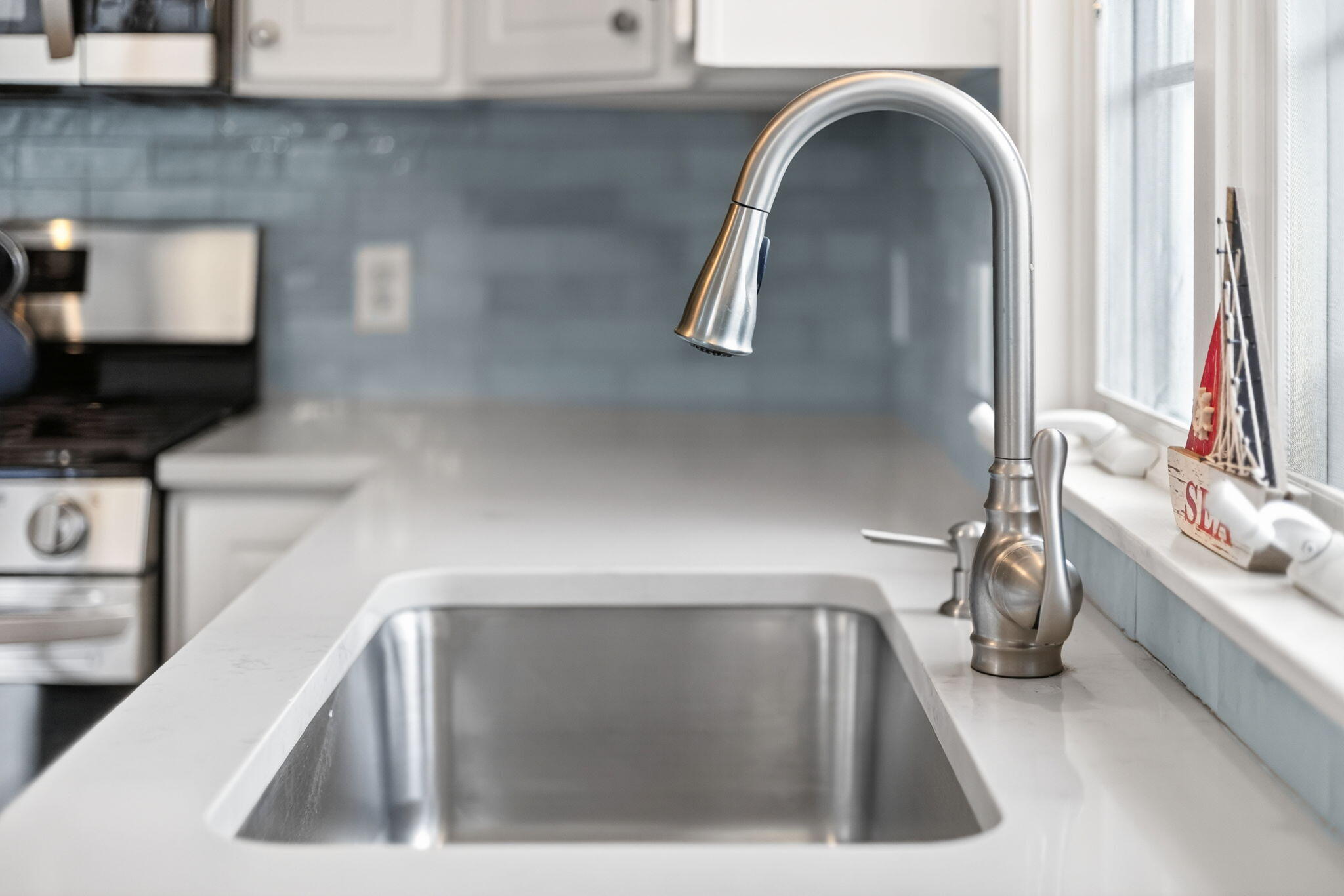 35 Pine Tree Road South Chatham, MA 02659 - Photo 10 of 39 a kitchen with a sink and a microwave