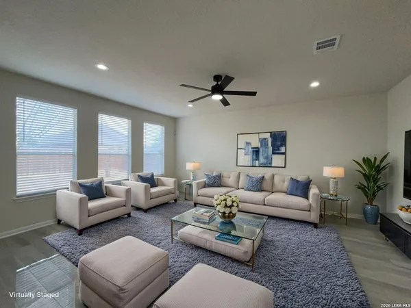 a living room with furniture and a large window