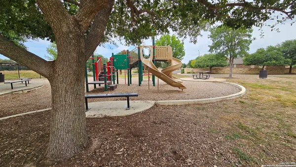 a view of swimming pool with seating space