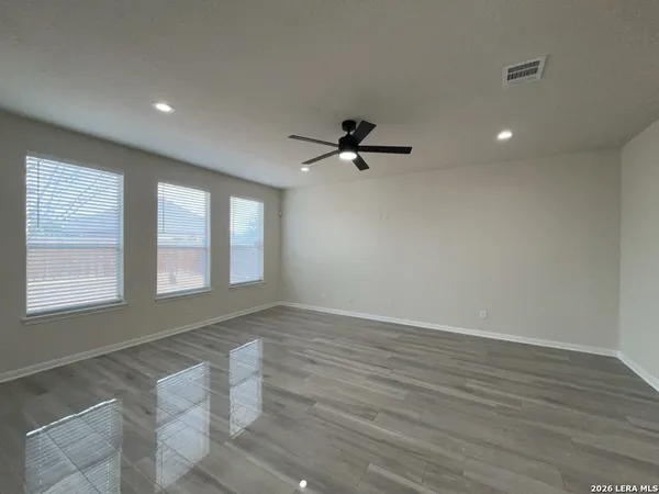 a view of an empty room with a window