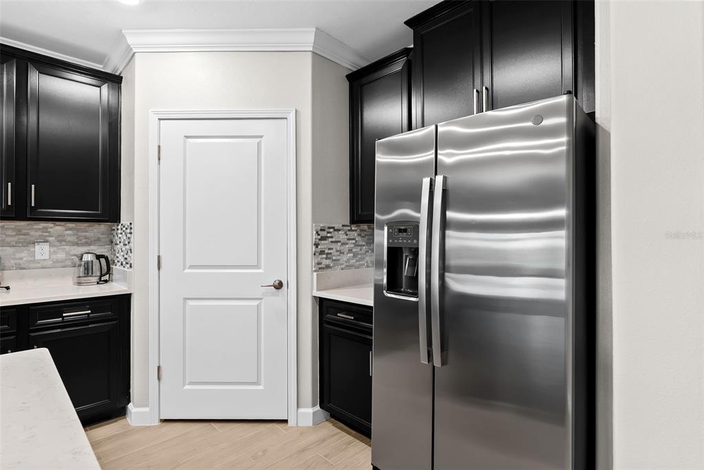 10232 Echo Dock Loop San Antonio, FL 33576 - Photo 11 of 43 a metallic refrigerator freezer sitting in a kitchen