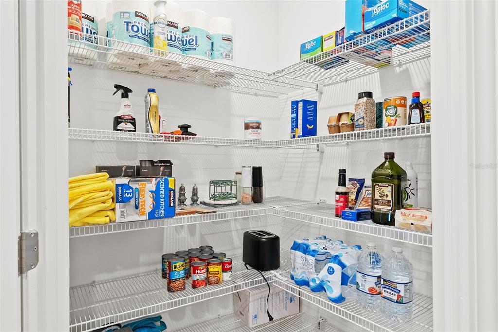 10232 Echo Dock Loop San Antonio, FL 33576 - Photo 12 of 43 a kitchen with a refrigerator and a sink