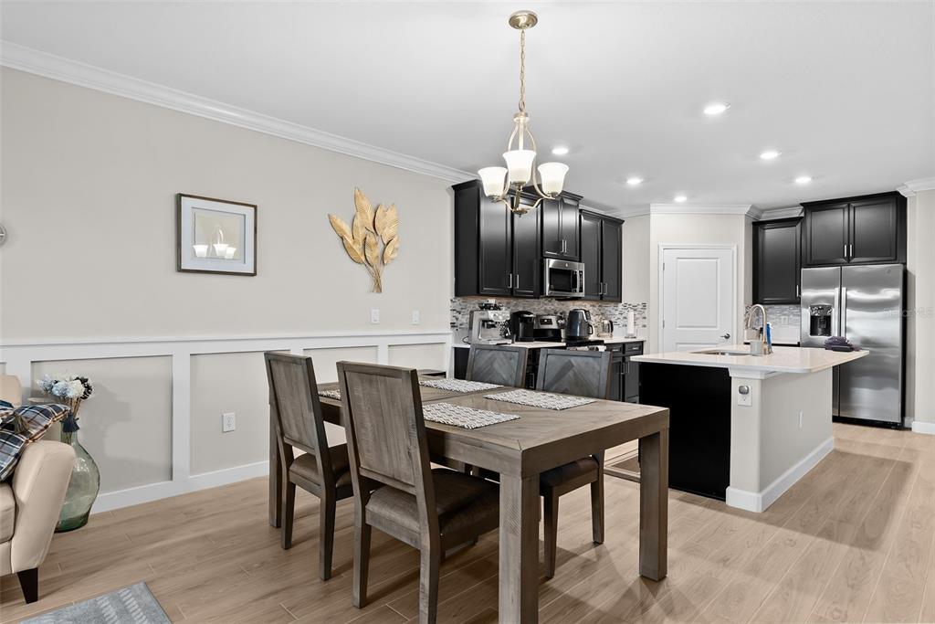 10232 Echo Dock Loop San Antonio, FL 33576 - Photo 14 of 43 a large kitchen with a table and chairs