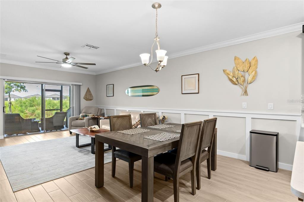 10232 Echo Dock Loop San Antonio, FL 33576 - Photo 15 of 43 a view of a dining room with furniture window and wooden floor