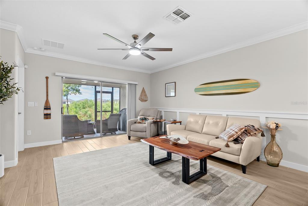 10232 Echo Dock Loop San Antonio, FL 33576 - Photo 16 of 43 a living room with furniture and a large window