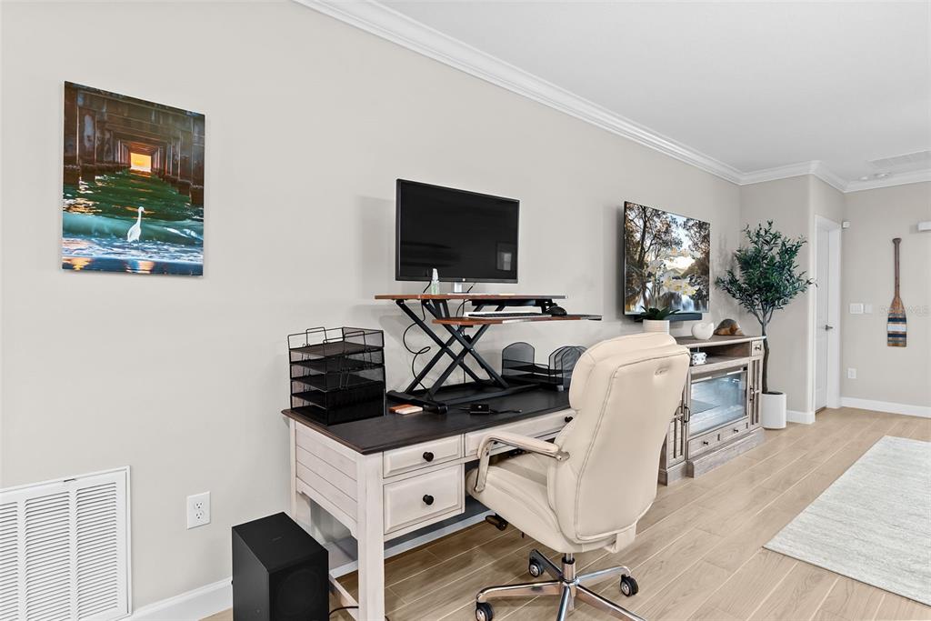 10232 Echo Dock Loop San Antonio, FL 33576 - Photo 19 of 43 a living room with furniture and a flat screen tv