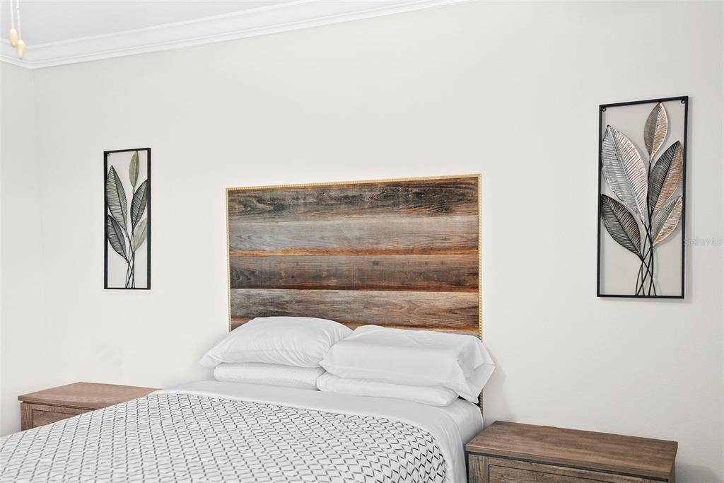 10232 Echo Dock Loop San Antonio, FL 33576 - Photo 22 of 43 a bedroom with a bed and a couch