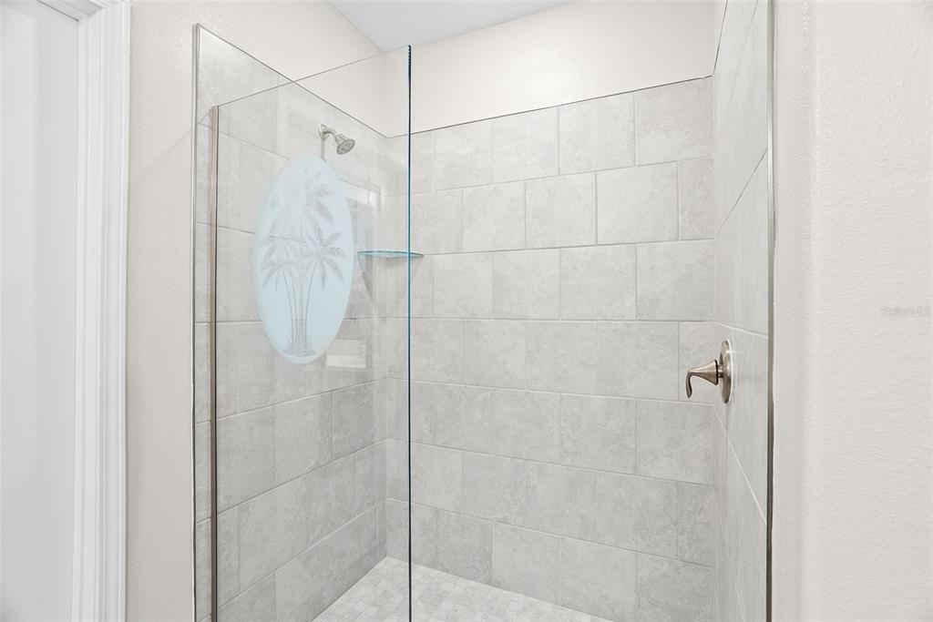 10232 Echo Dock Loop San Antonio, FL 33576 - Photo 26 of 43 a bathroom with a shower