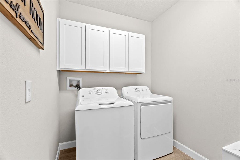 10232 Echo Dock Loop San Antonio, FL 33576 - Photo 34 of 43 a utility room with dryer and washer