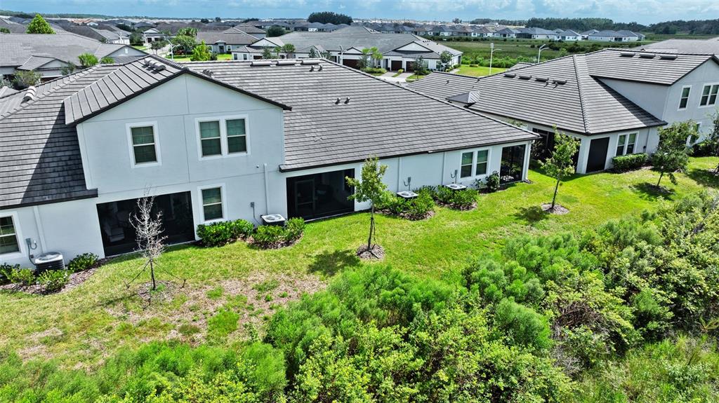 10232 Echo Dock Loop San Antonio, FL 33576 - Photo 37 of 43 an aerial view of a house with yard and green space