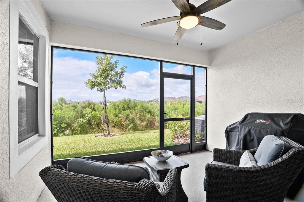 10232 Echo Dock Loop San Antonio, FL 33576 - Photo 4 of 43 a living room with furniture and a large window