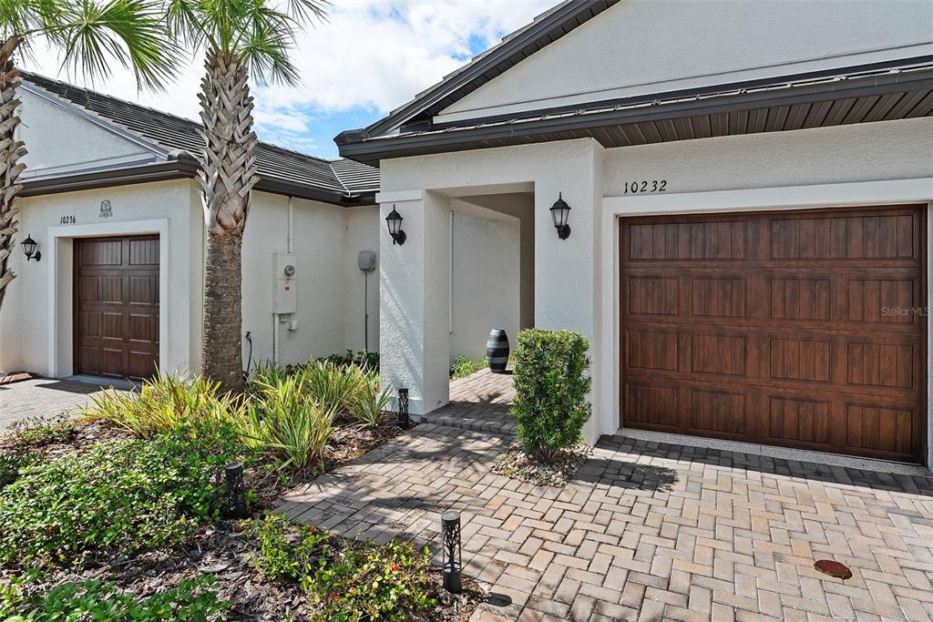 10232 Echo Dock Loop San Antonio, FL 33576 - Photo 5 of 43 a couple of potted plants in front of door