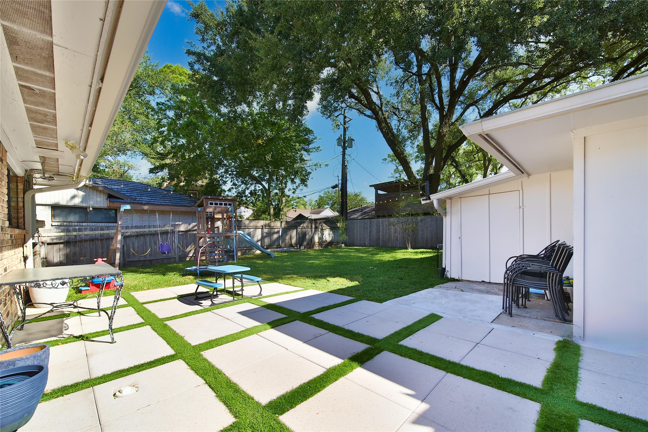 4402 Fallbrook Drive Houston, TX 77018 - Photo 7 of 29 Generous patio and play-friendly backyard offering plenty of room for kids, pets, and outdoor gatherings