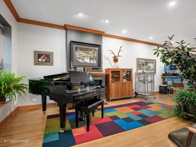 a living room with furniture and pool table