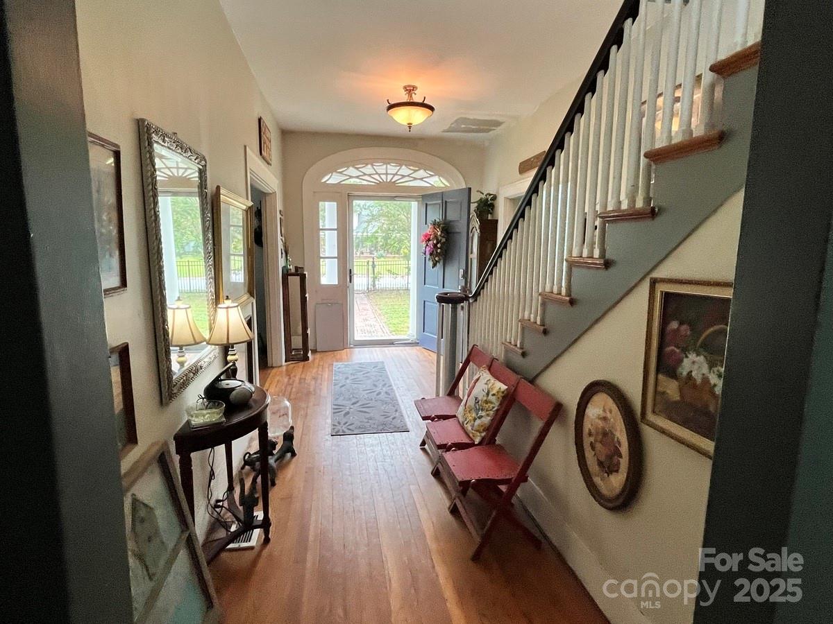 423 East Main Street Conway, NC 27820 - Photo 29 of 44 a view of entryway livingroom and hall with wooden floor