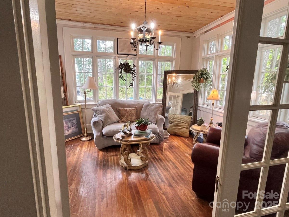 423 East Main Street Conway, NC 27820 - Photo 30 of 44 a living room with furniture and a chandelier