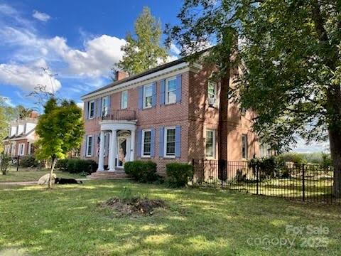 423 East Main Street Conway, NC 27820 - Photo 4 of 44 a front view of a house with a yard