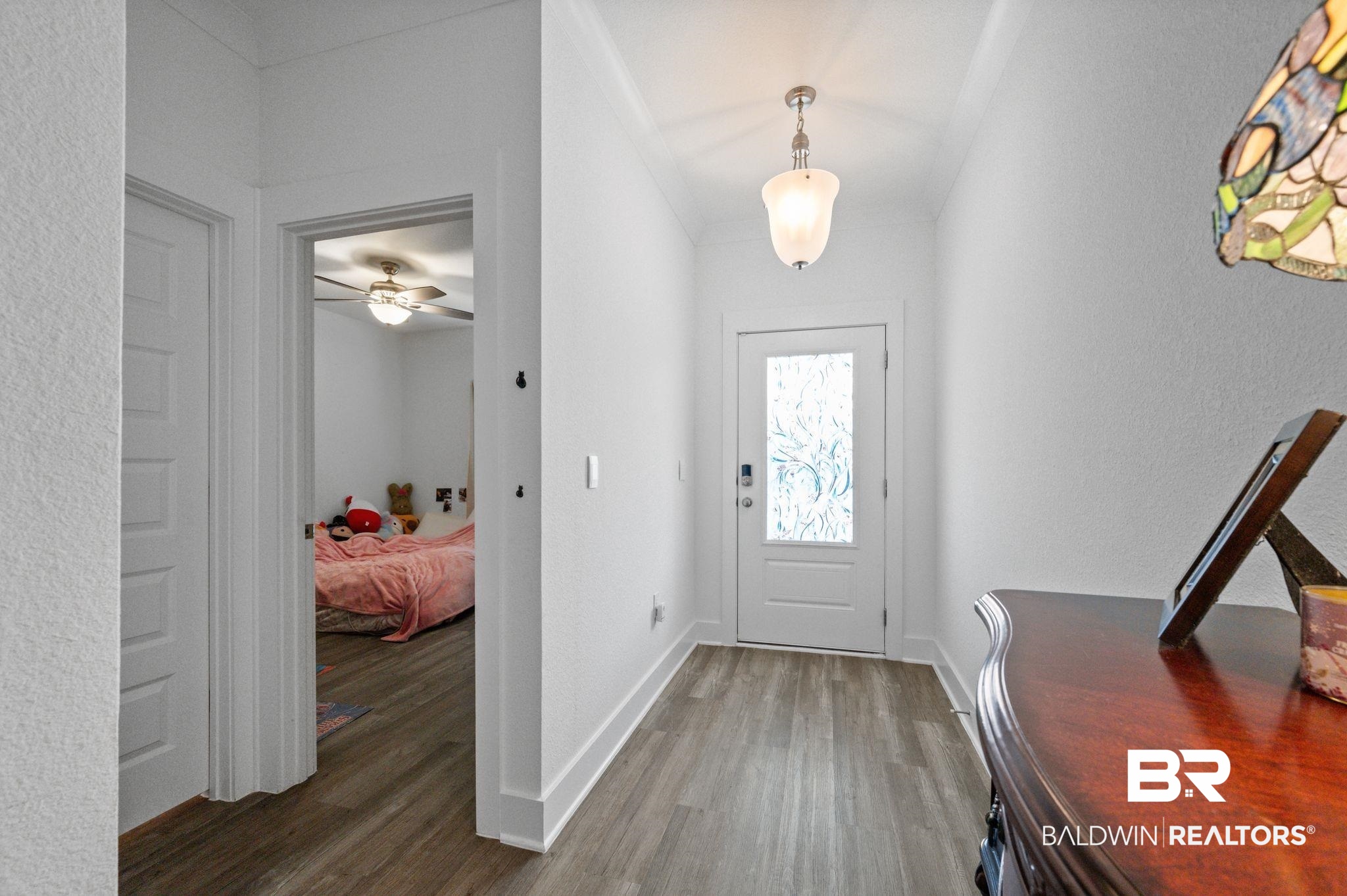 8508 Rosedown Lane Daphne, AL 36526 - Photo 5 of 29 Entryway featuring wood-finish flooring and a decorative glass front door