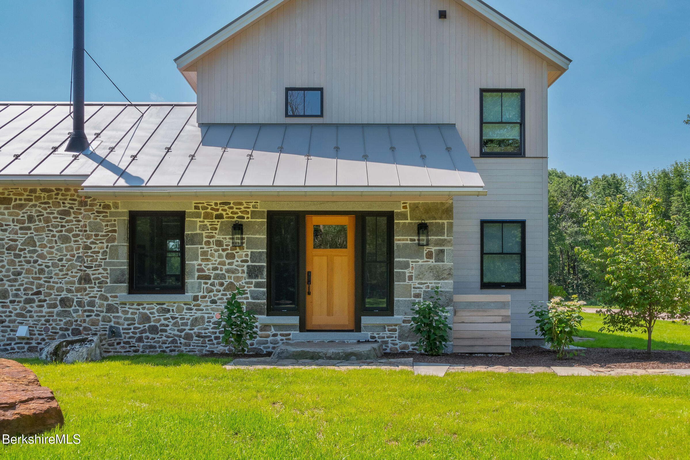 194 Sandisfield Road Sandisfield, MA 01255 - Photo 15 of 59 a front view of a house with a yard