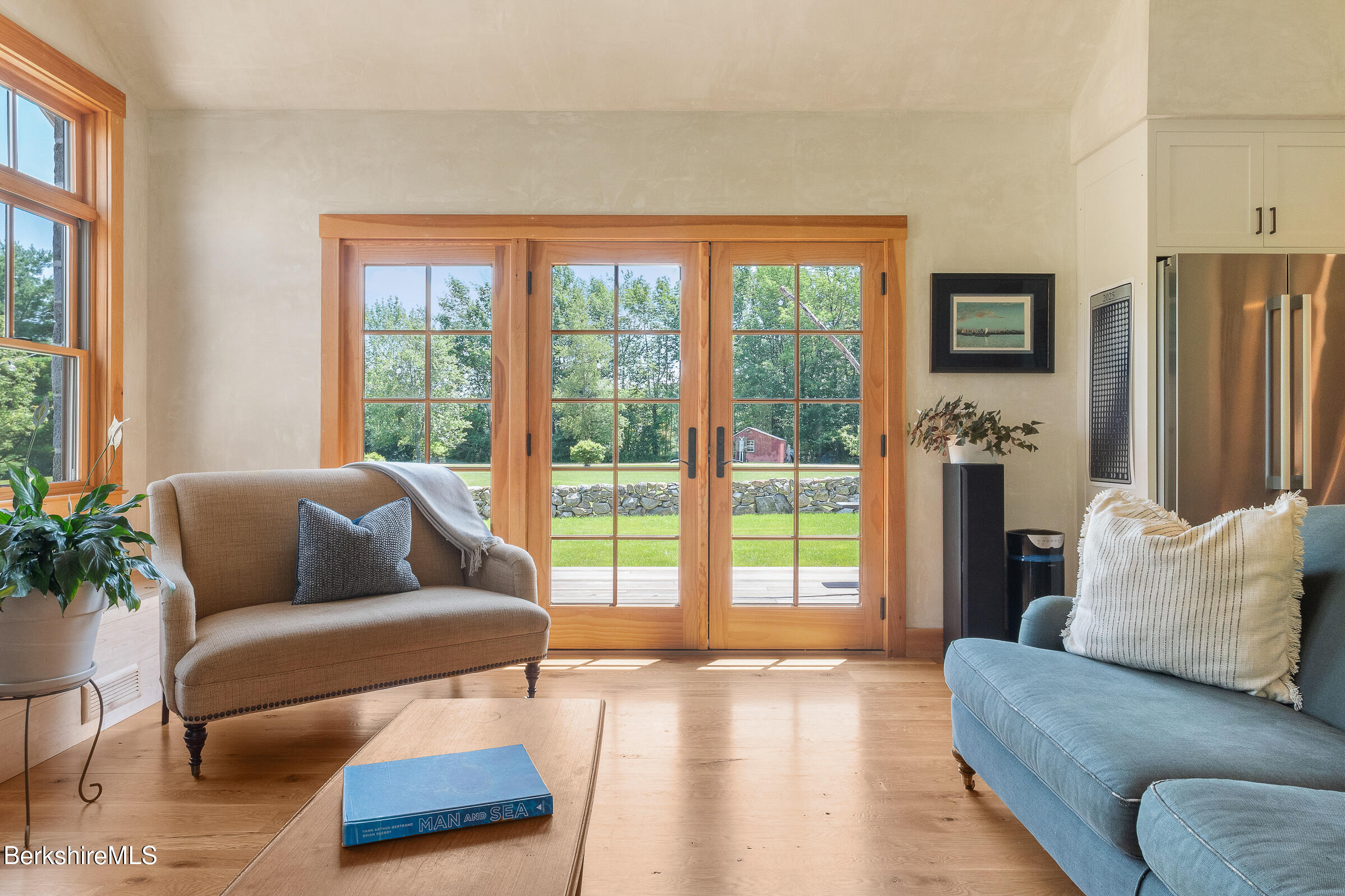 194 Sandisfield Road Sandisfield, MA 01255 - Photo 29 of 59 a living room with furniture and a floor to ceiling window