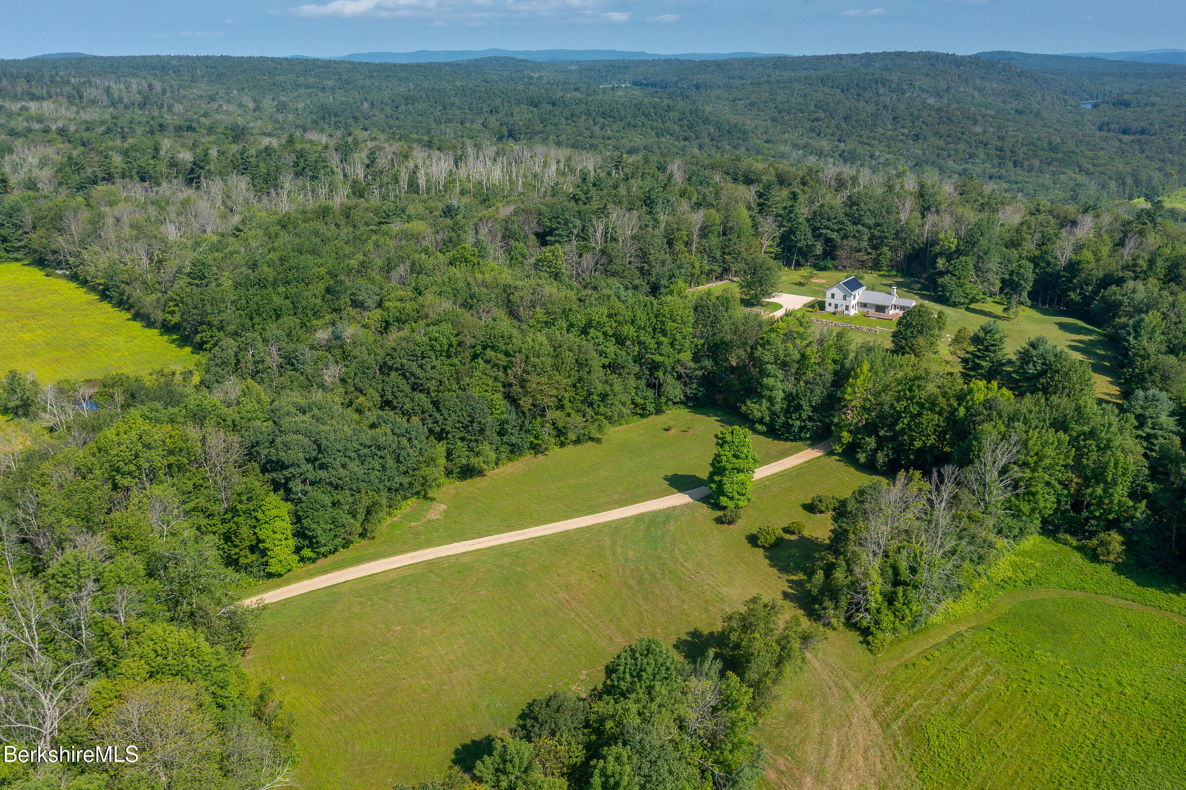 194 Sandisfield Road Sandisfield, MA 01255 - Photo 31 of 59 a view of a forest with a houses