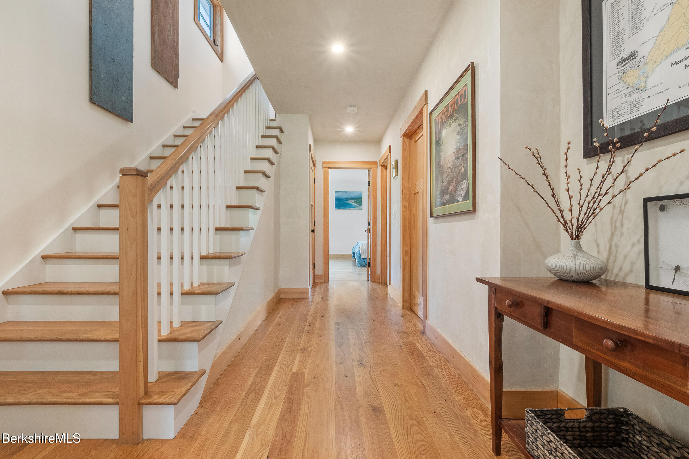 194 Sandisfield Road Sandisfield, MA 01255 - Photo 40 of 59 a view of a hallway with wooden floor and staircase