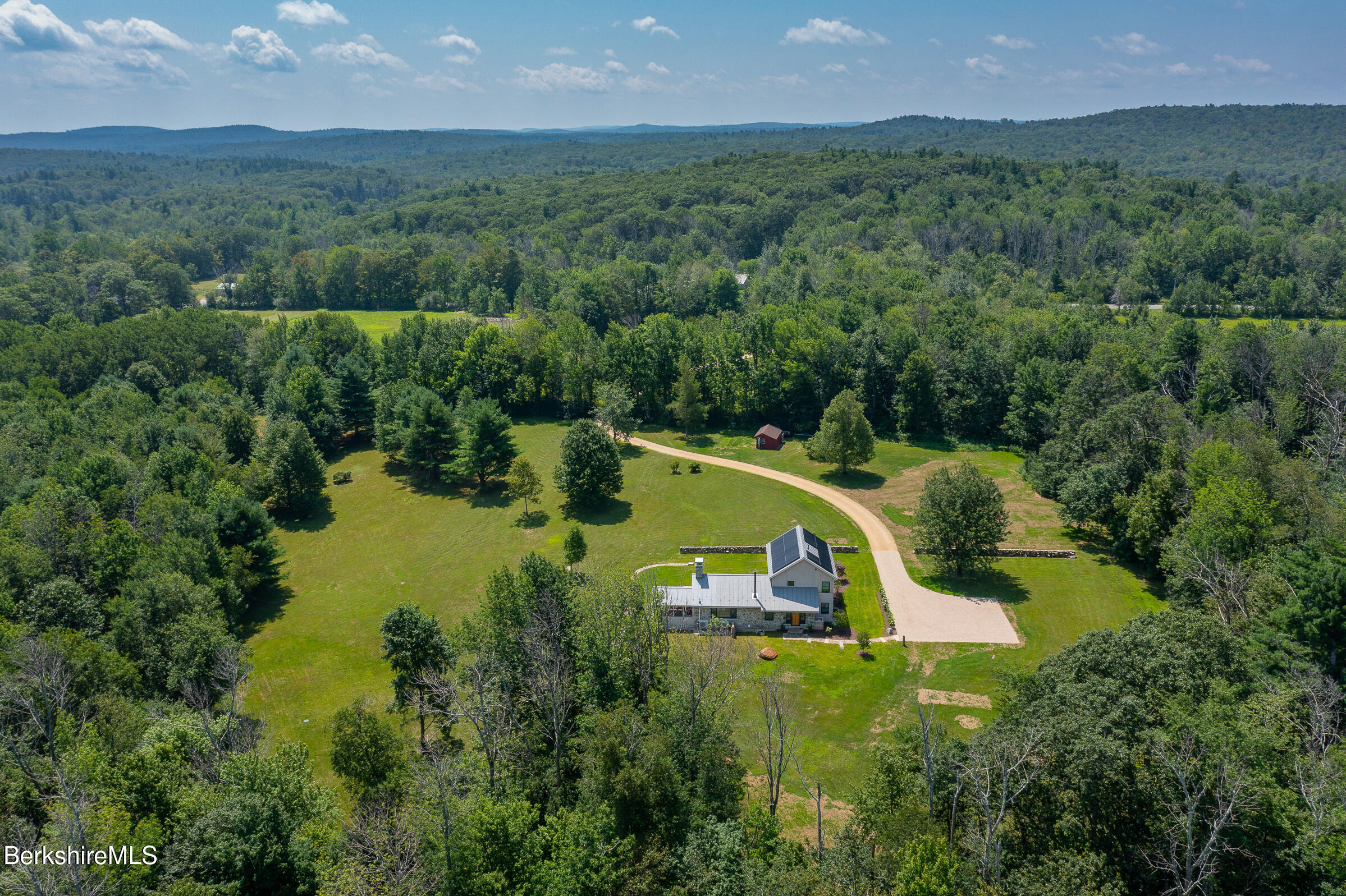 194 Sandisfield Road Sandisfield, MA 01255 - Photo 59 of 59 an aerial view of a house with a swimming pool and mountains