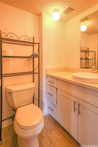 a bathroom with a toilet and a sink