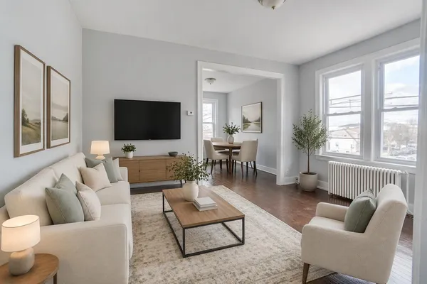 a living room with furniture and a flat screen tv