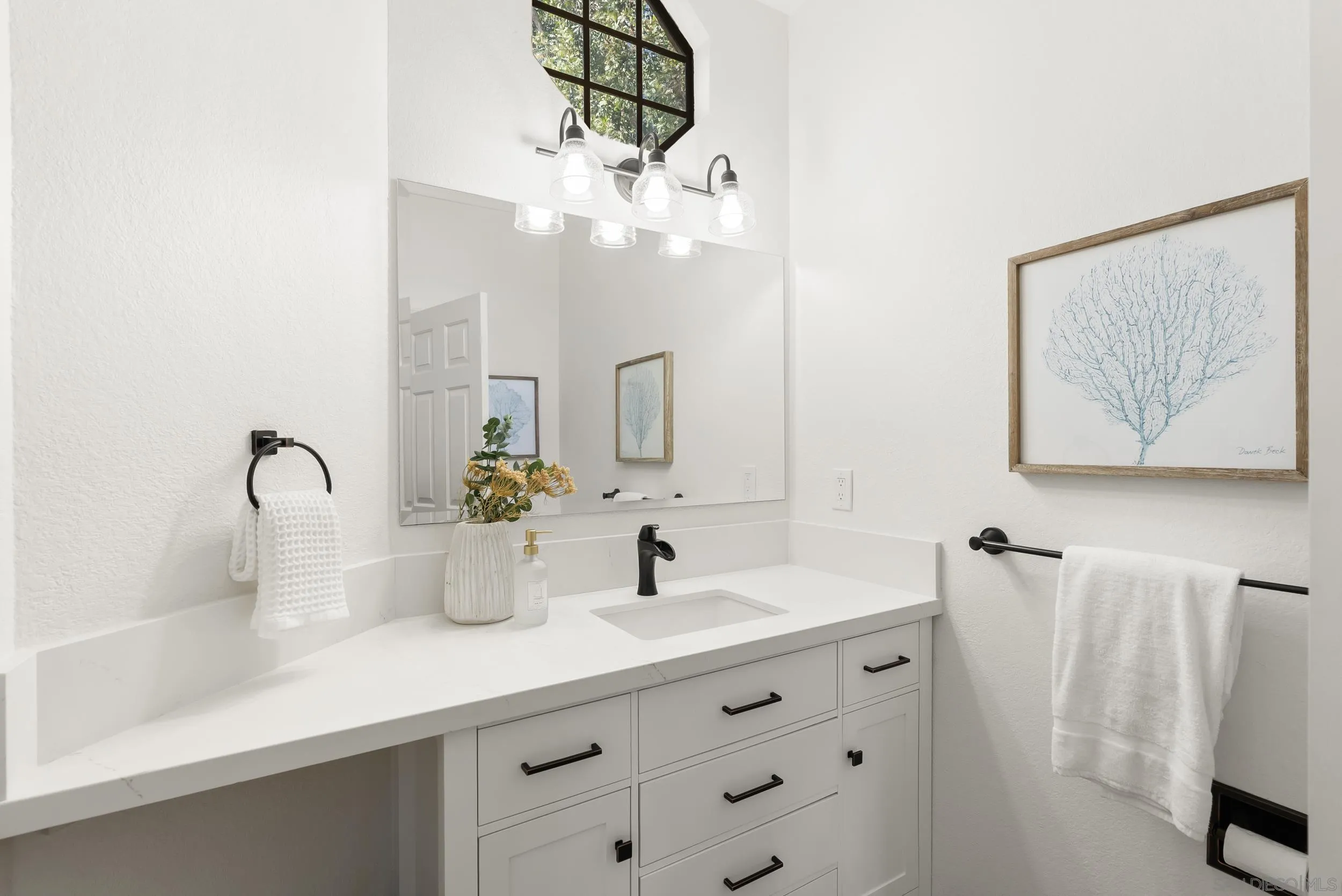 1240 Ladera Linda Del Mar, CA 92014 - Photo 13 of 35 a bathroom with a double vanity sink and a mirror