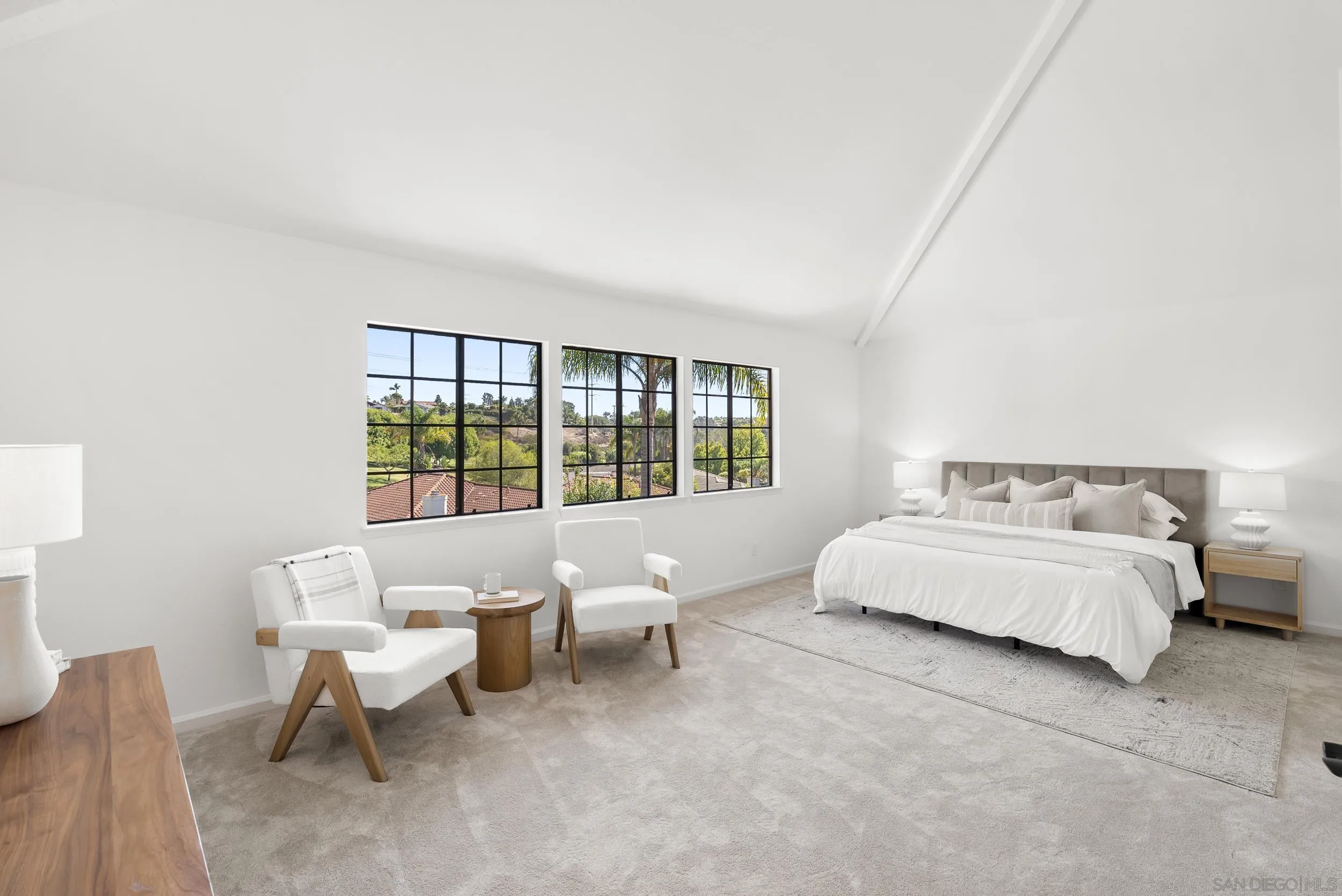 1240 Ladera Linda Del Mar, CA 92014 - Photo 14 of 35 a spacious bedroom with a bed and a large window
