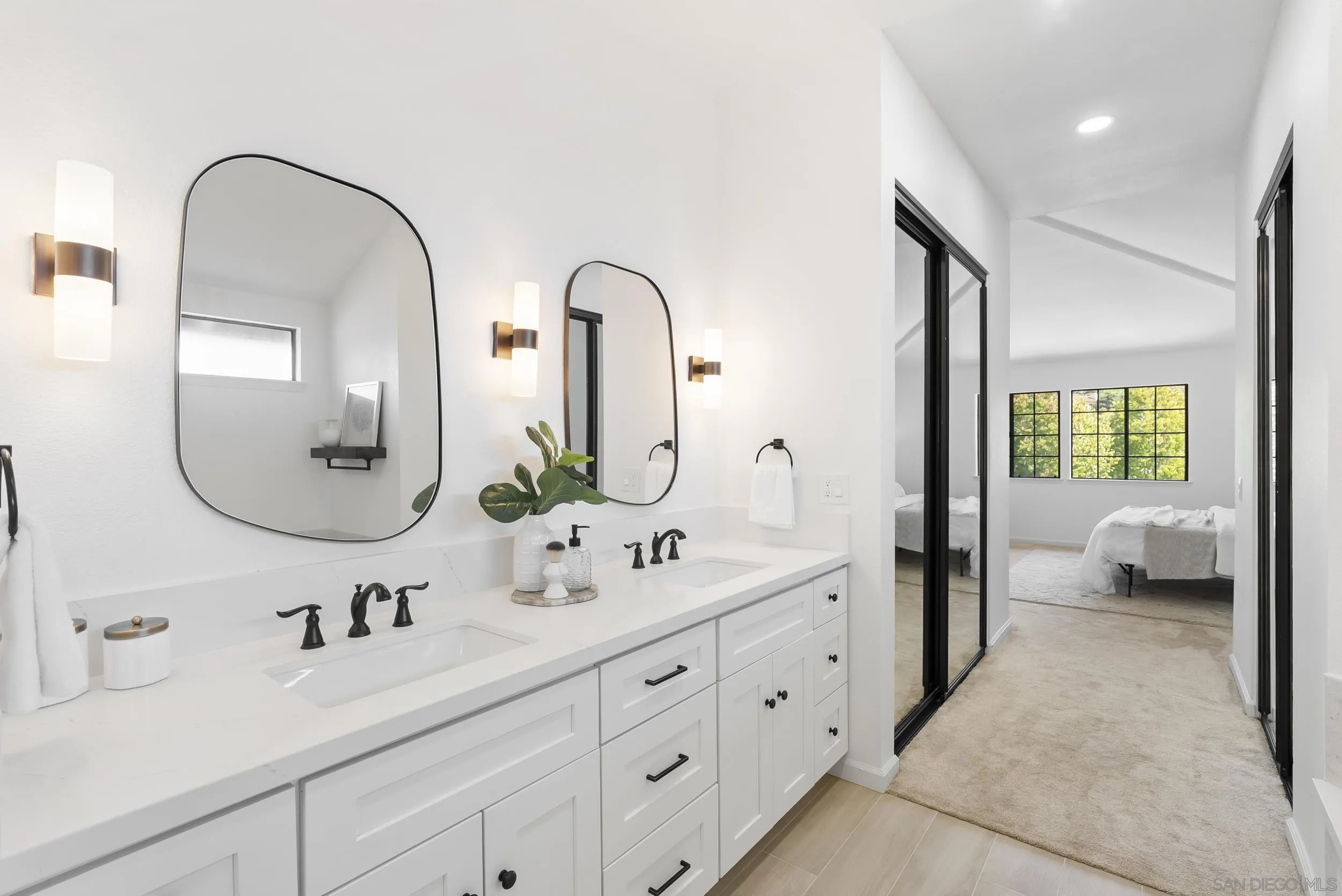 1240 Ladera Linda Del Mar, CA 92014 - Photo 19 of 35 a en suite bathroom with double sink and a large mirror