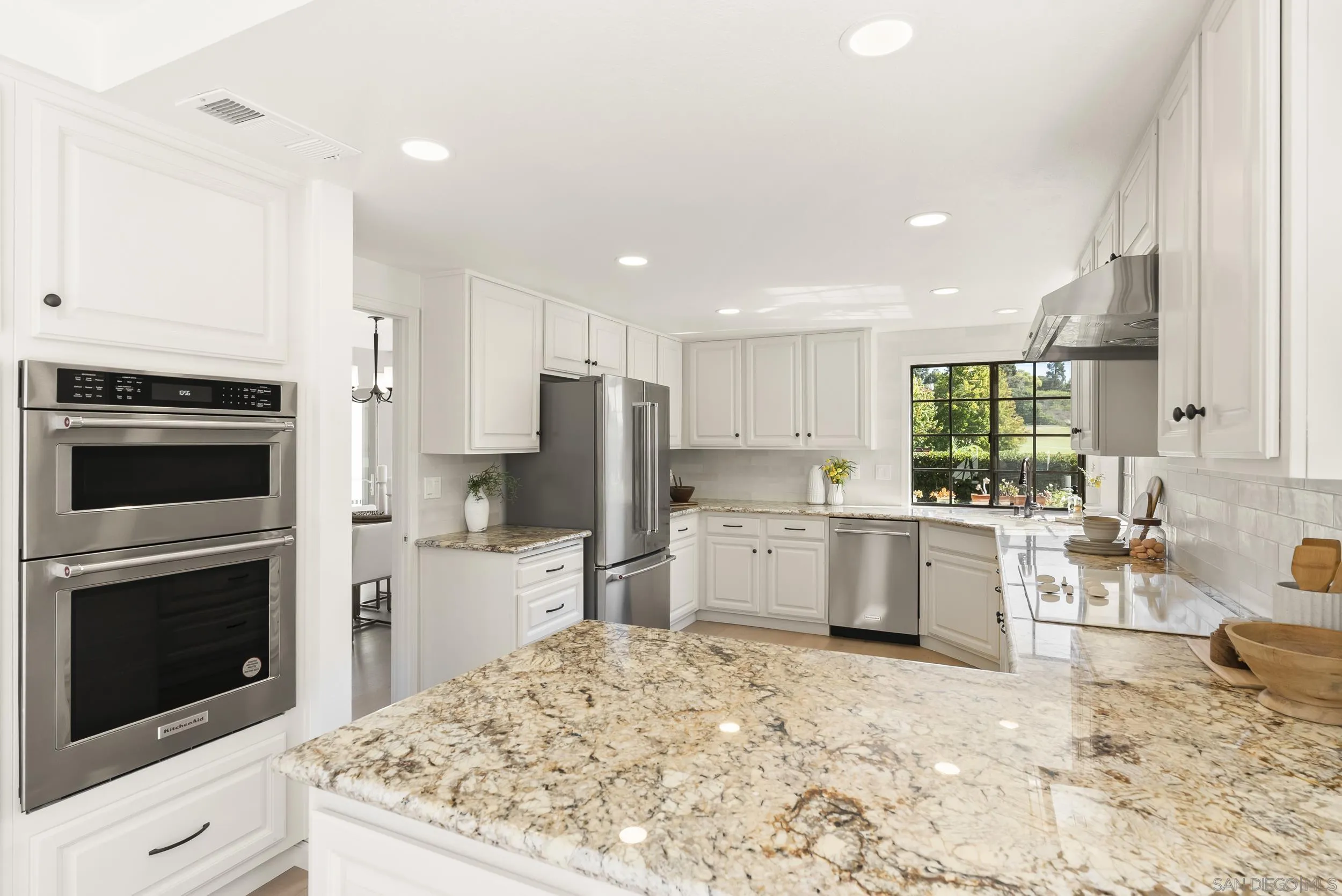 1240 Ladera Linda Del Mar, CA 92014 - Photo 8 of 35 a kitchen with refrigerator and cabinets