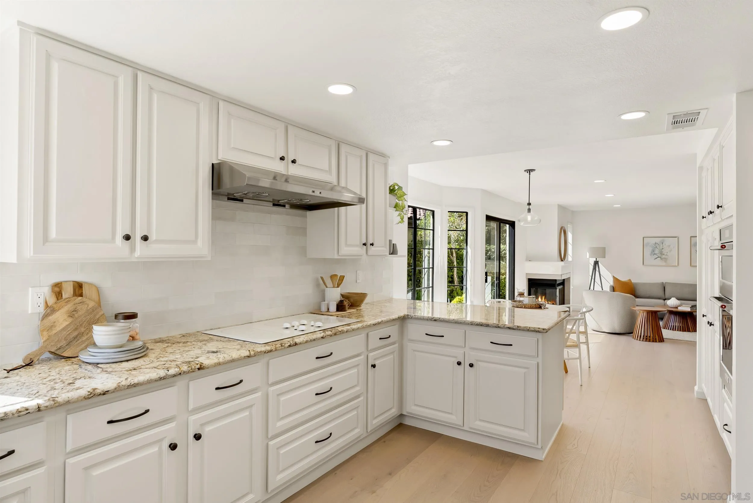 1240 Ladera Linda Del Mar, CA 92014 - Photo 9 of 35 a kitchen with white cabinets and sink