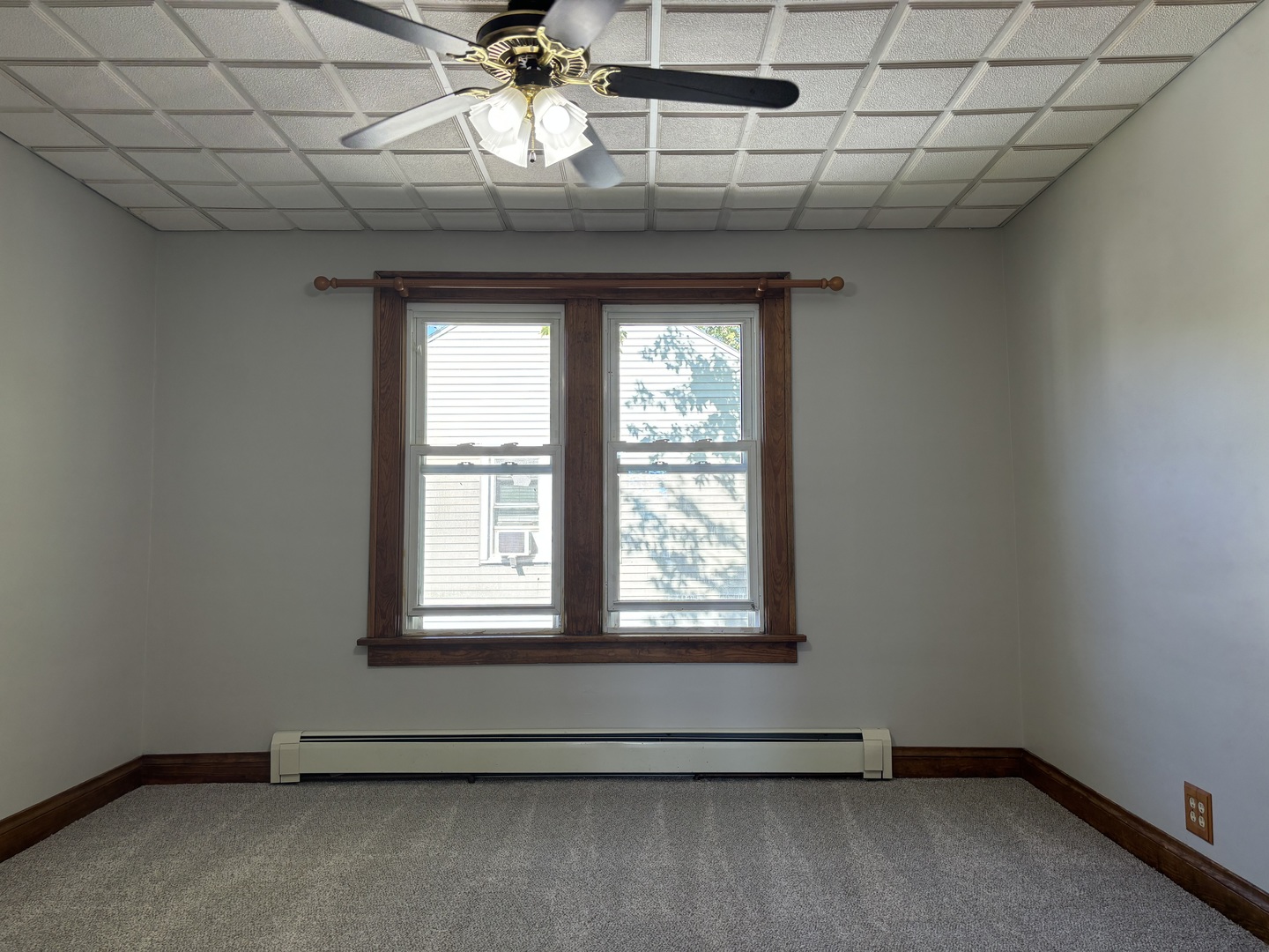 912 Clay Street Woodstock, IL 60098 - Photo 11 of 15 a room with a window and ceiling fan