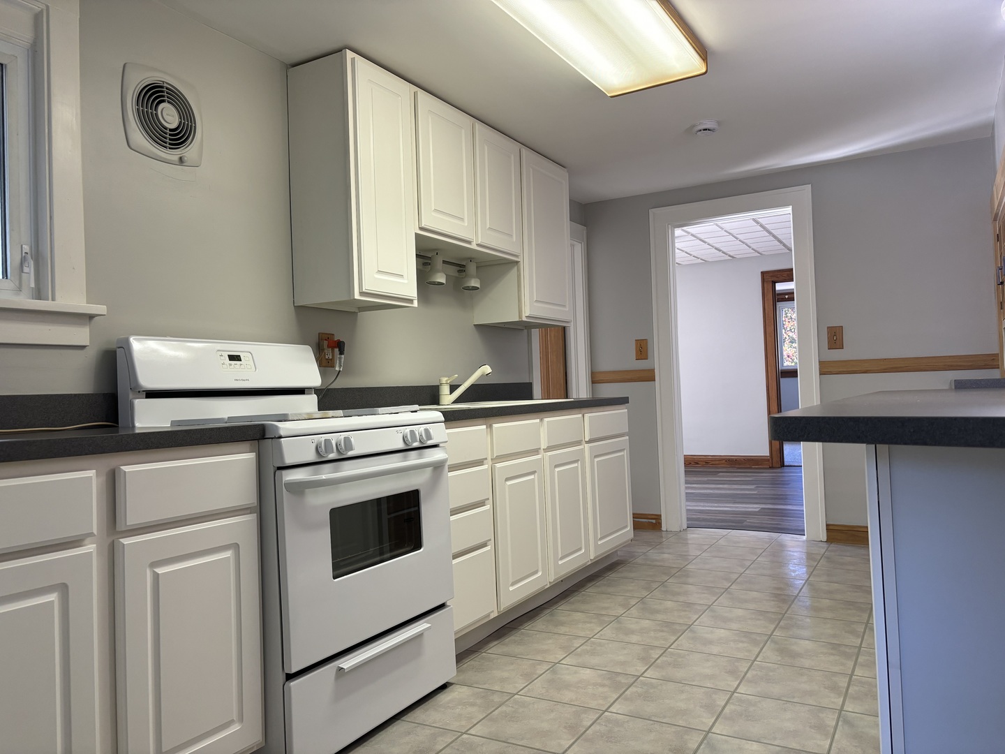 912 Clay Street Woodstock, IL 60098 - Photo 15 of 15 a kitchen with stainless steel appliances granite countertop a stove a sink and a refrigerator